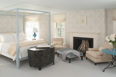Example of a mid-sized classic master carpeted and brown floor bedroom design in Boston with blue walls, a standard fireplace and a wood fireplace surround