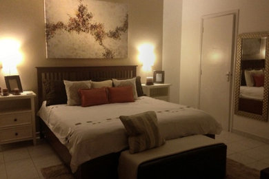 Bedroom - mid-sized contemporary master bedroom idea in Other with multicolored walls