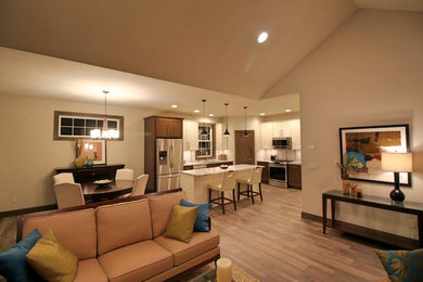 Mid-sized transitional l-shaped light wood floor kitchen photo in Other with a double-bowl sink, beaded inset cabinets, medium tone wood cabinets, marble countertops, white backsplash, ceramic backsplash, stainless steel appliances and an island