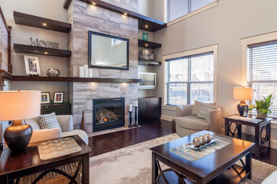 Inspiration for a mid-sized transitional open concept dark wood floor living room remodel in Other with gray walls, a standard fireplace, a tile fireplace and a wall-mounted tv
