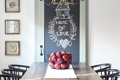 Inspiration for a farmhouse dark wood floor dining room remodel in New York with white walls