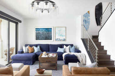 Mid-sized beach style open concept wainscoting family room photo in Other with white walls and a wall-mounted tv