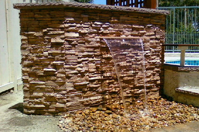 Design ideas for a small craftsman full sun backyard water fountain landscape in Orange County.