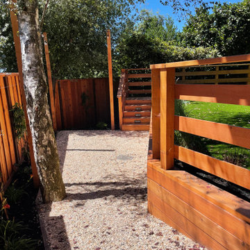 Retaining wall used for leveling the lawn area created additional seating area.