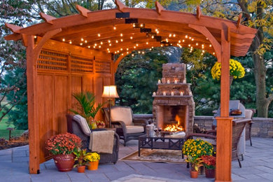 12x14 Hearthside Wooden Pergola with arched rafters, enhanced by a beautiful fir
