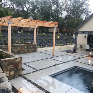 Pergola with bocce ball court in background