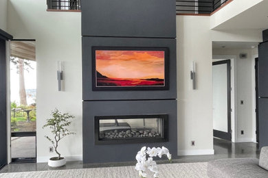 Example of a trendy living room design in Seattle with black walls, a two-sided fireplace and a wall-mounted tv