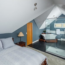 open plan main bedroom bathroom