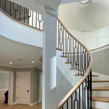 Project #95 | Freestanding Elliptical Staircase with Geometric Iron Balusters