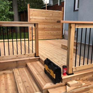 Red cedar deck with black round balusters