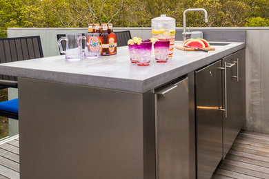 Inspiration for a mid-sized contemporary backyard outdoor kitchen deck remodel in New York
