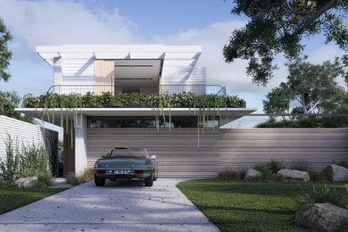 Mid-sized beach style home design in Gold Coast - Tweed.