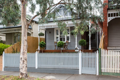 Photo of a mid-sized traditional home design in Melbourne.