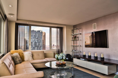 Mid-sized trendy open concept light wood floor family room photo in New York with a wall-mounted tv and multicolored walls