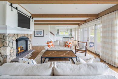 Example of a beach style living room design in Boston