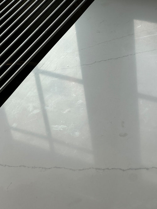 Brand new white Viatera quartz countertops have streaks allover them