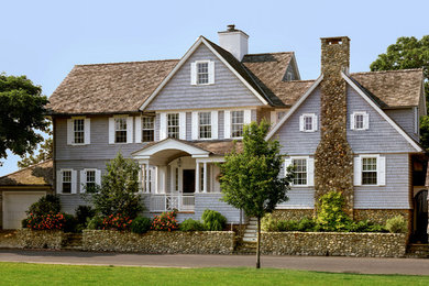 Large traditional blue two-story mixed siding gable roof idea in New York