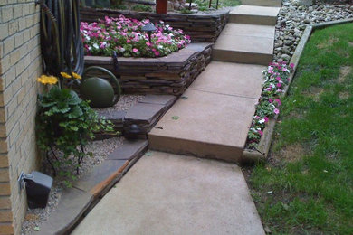 Photo of a large front yard stone water fountain landscape in Other.