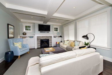 Inspiration for a mid-sized craftsman formal and enclosed medium tone wood floor living room remodel in Other with blue walls, a standard fireplace, a tile fireplace and a wall-mounted tv