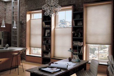 Home office - mid-sized industrial freestanding desk light wood floor home office idea in Detroit