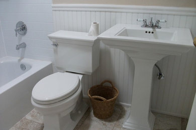 Mid-sized trendy 3/4 white tile and porcelain tile porcelain tile and beige floor bathroom photo in San Diego with beige walls, a pedestal sink and solid surface countertops