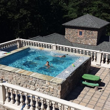 Tuscan style glass bottom rooftop pool