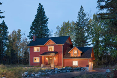 Mid-sized elegant red two-story mixed siding gable roof photo in Other
