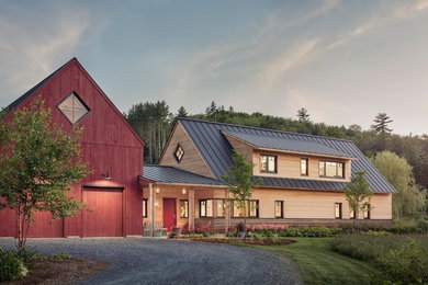 Example of a mid-sized trendy brown wood exterior home design in Portland Maine