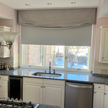 Soft roman valance with motorized roller shade in kitchen