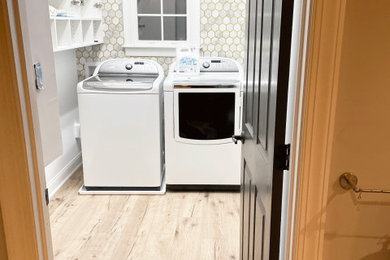 Example of a cottage laundry room design in Charlotte