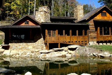 Example of a mid-sized mountain style brown one-story mixed siding exterior home design in Other