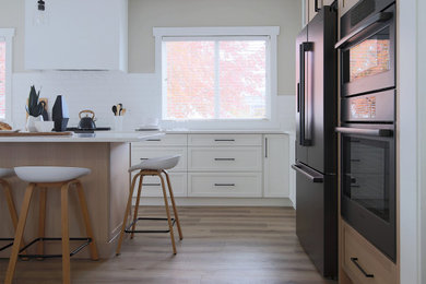 Example of a transitional kitchen design in Vancouver