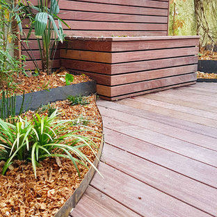 Design ideas for a medium sized world-inspired back patio in Nantes with decking and an awning.