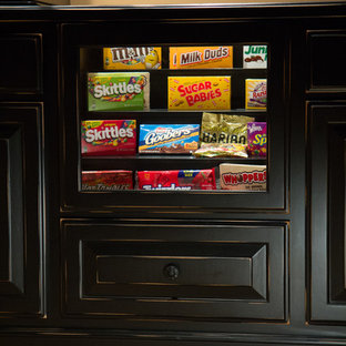 Large traditional open plan home cinema in Raleigh with beige walls, carpet and a projector screen.