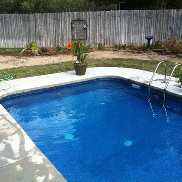 Polymer in-ground pool with vinyl liner