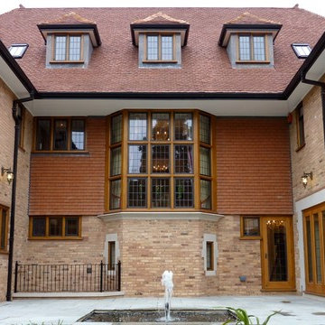 Rear elevation with Oriel staircase window and stone Loggia