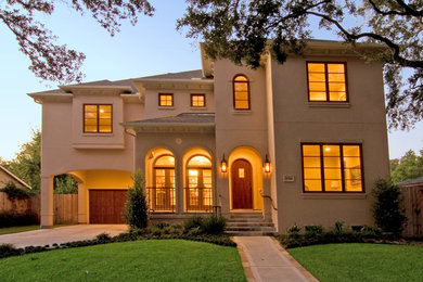 Mid-sized transitional beige two-story stucco exterior home photo in Houston