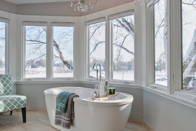 Mid-sized transitional master brown tile porcelain tile and beige floor bathroom photo in Chicago with dark wood cabinets, gray walls, an undermount sink, marble countertops, a hinged shower door and white countertops