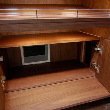 Hidden feline passageway in a luxury his-and-hers master closet
