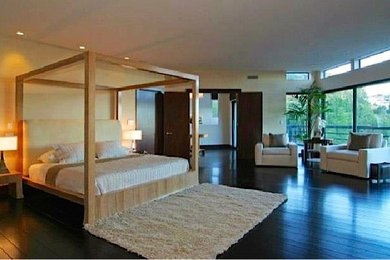 Bedroom - large contemporary master dark wood floor bedroom idea in Los Angeles with beige walls and no fireplace