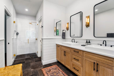 Bathroom - industrial master white tile and porcelain tile double-sink, shiplap wall, porcelain tile and black floor bathroom idea in Other with light wood cabinets, a niche, a two-piece toilet, white walls, a vessel sink, quartz countertops, a hinged shower door, white countertops, a built-in vanity and shaker cabinets