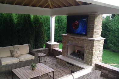 Patio - mid-sized modern backyard patio idea in Other with a fire pit