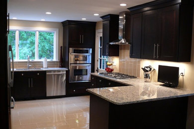 Inspiration for a mid-sized modern u-shaped ceramic tile and gray floor eat-in kitchen remodel in Los Angeles with an undermount sink, shaker cabinets, dark wood cabinets, granite countertops, gray backsplash, ceramic backsplash, stainless steel appliances, a peninsula and multicolored countertops