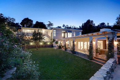 Inspiration for a large contemporary white two-story house exterior remodel in Los Angeles