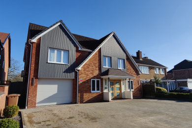 Design ideas for a contemporary house exterior in West Midlands.