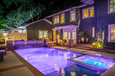 Example of a mid-sized arts and crafts backyard concrete and rectangular natural hot tub design in Los Angeles