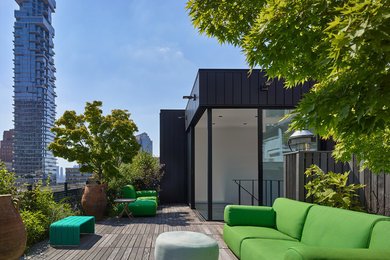 Mid-sized trendy rooftop rooftop deck photo in New York with no cover