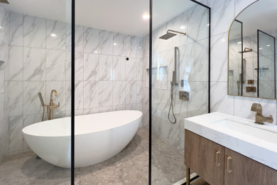 Example of a mid-sized minimalist master white tile gray floor and single-sink bathroom design in Orange County with flat-panel cabinets, light wood cabinets, a one-piece toilet, white walls, an undermount sink, white countertops and a floating vanity