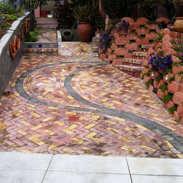 Front Yard with Artistic Driveway, Custom Sculptures, Planted Walls