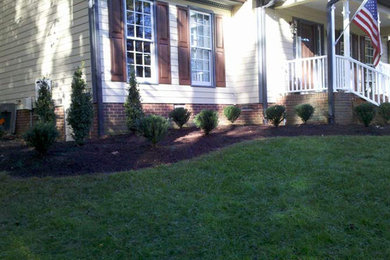 Photo of a transitional home design in Charlotte.